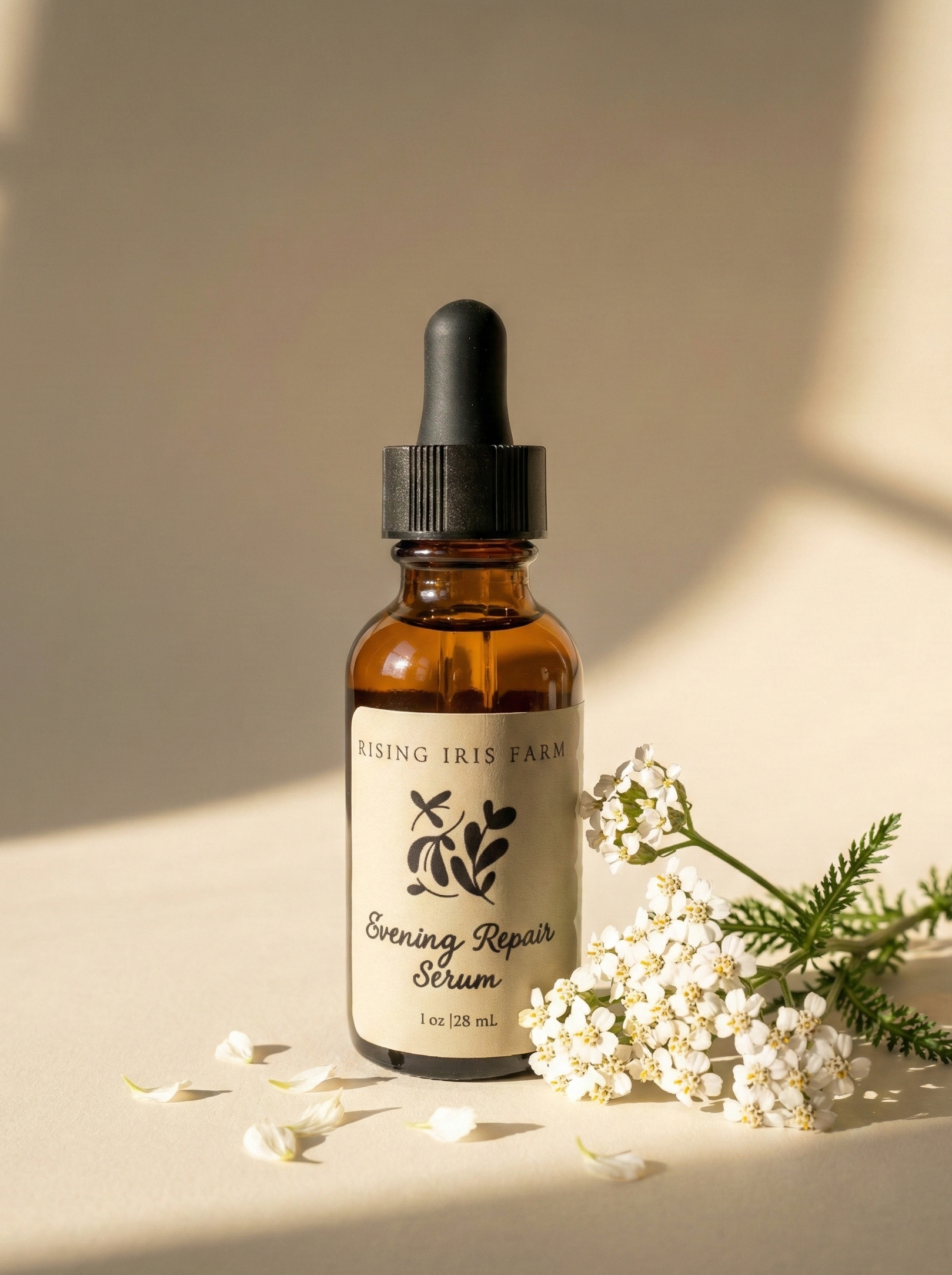 Bottle of Evening Repair Serum from Rising Iris Farm on a neutral background with flowers.